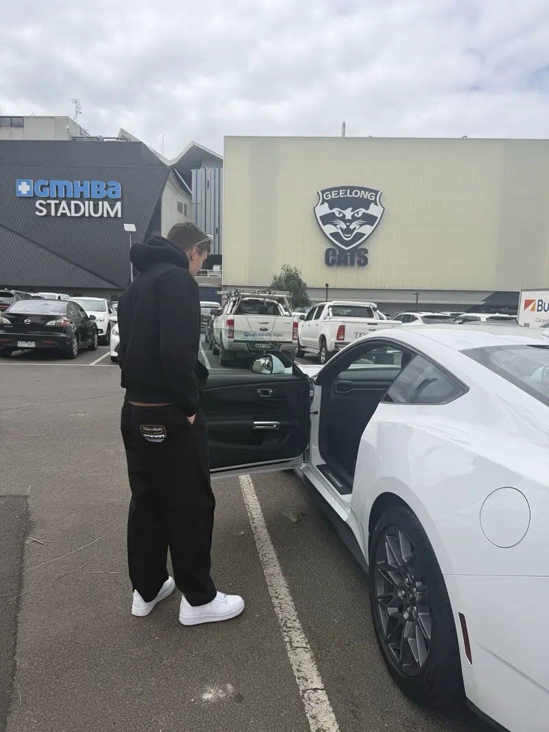 A white Ford Mustang on an automotive shoot outside GMHBA Stadium, Geelong