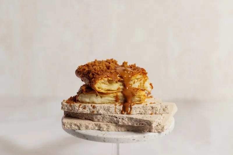 Biscoff bougatsa stacked on a stone stand